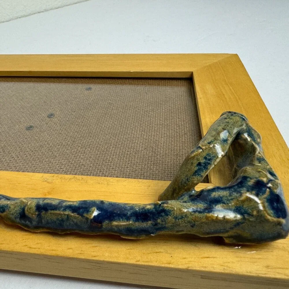 Exclusive! Wooden frame with a ceramic sculpture of a man Handmade